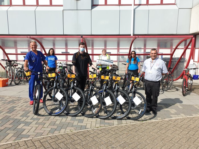 Consultant Physician Damian Jenkinson (left) was the first staff member to receive his bike